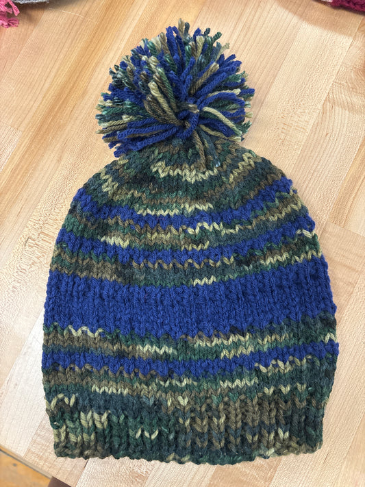 Hand knit winter hat with pom-pom